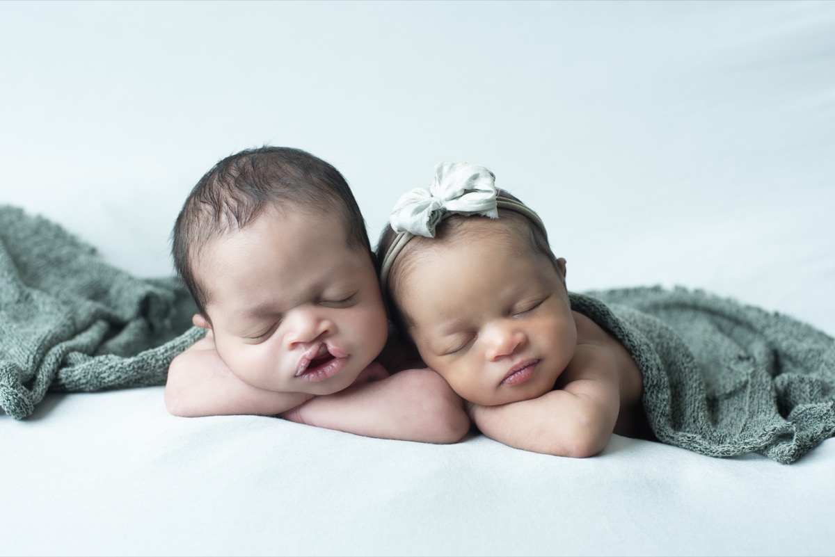 Newborn twins sleeping together